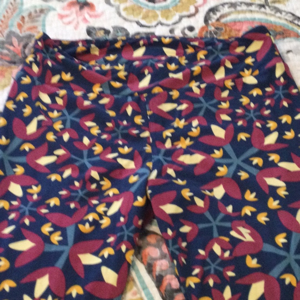 Brand new Lularoe Leggings, Size TC. Blue with Floral pattern in burgundy, blue